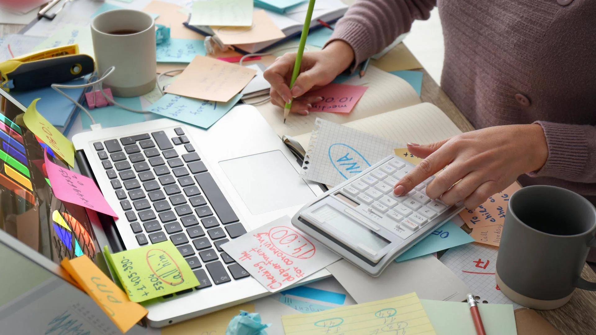 Messy desk representing how messy building a farm or homestead can be