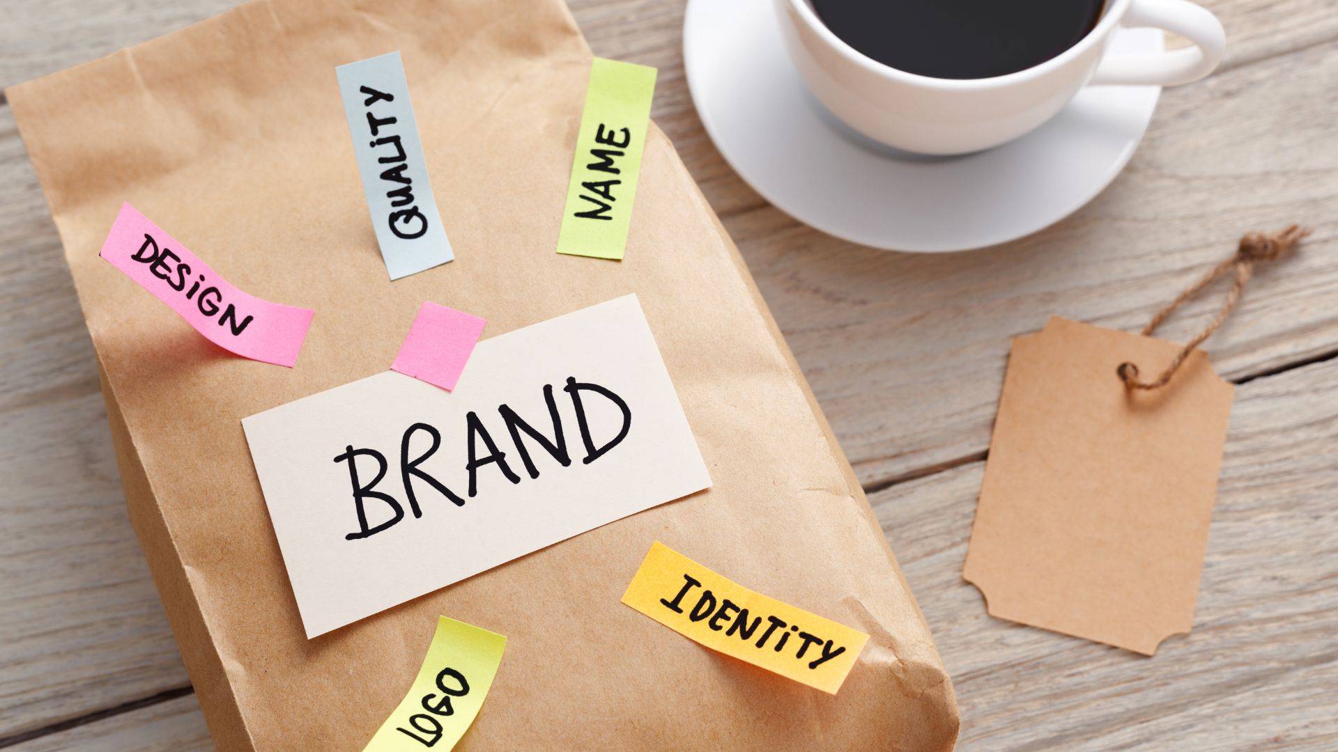 Farm website branding concept - brown folder labeled 'BRAND' with sticky notes showing web design elements like 'QUALITY,' 'TRUST,' and 'IDENTITY' for small farm marketing